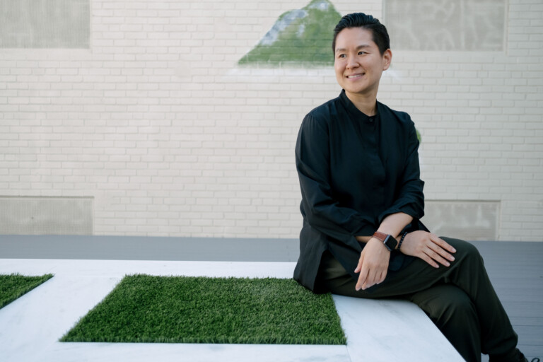 Grace seated outdoors